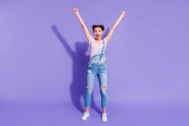 Full length body size photo beautiful funky she her lady two buns hands arms up show best emotions cheerleader wear casual t-shirt jeans denim overalls outfit isolated purple violet bright background - Photo, Image