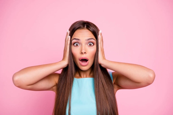 Unexpected Portrait of astonished confused teen model on rose-colored background listen information wonder touching head yelling isolated in colorful clothing  - Foto, imagen