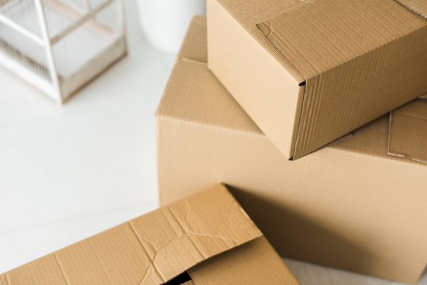 Brown cardboard boxes on light surface at home - Photo, Image