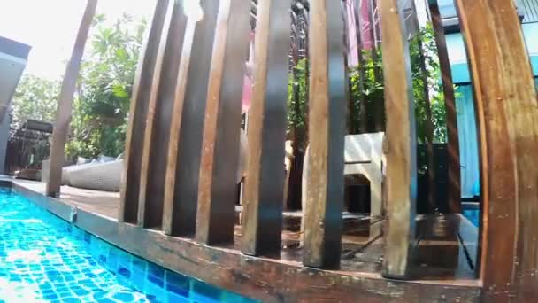 girl jump into swimming pool - Footage, Video
