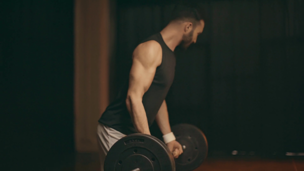 Bearded muscular powerlifter in white shorts training with barbell - Záběry, video