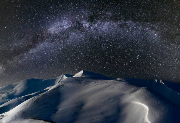 Night winter mountains in Moon light and Milky Way in sky - Foto, Bild