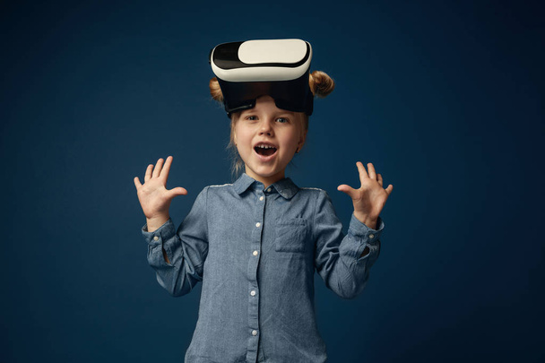 Child with virtual reality headset - Фото, изображение