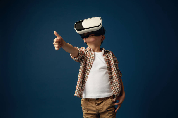 Child with virtual reality headset - Фото, изображение