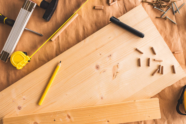 Pencil on woodwork carpentry workshop table - Fotó, kép