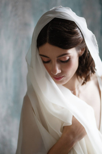 Portrait of a young bride, open wedding dress - Fotó, kép
