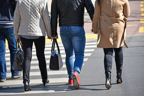 People are walking at the pedestrian crossing - Photo, Image