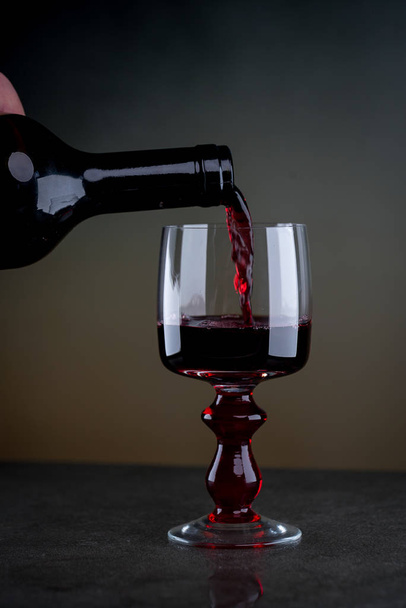 Aromatic wine in glass on blurred background - Photo, Image