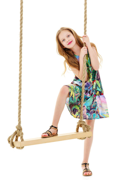 Little girl swinging on a swing - Photo, Image