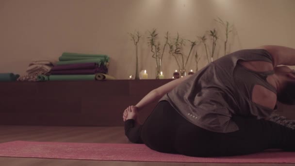 Partner Yoga. Two women doing yoga asanas in pair - Footage, Video