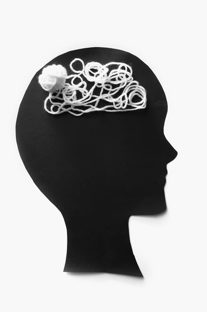 Human head with threads on white background. Concept of healthy brain - Photo, Image