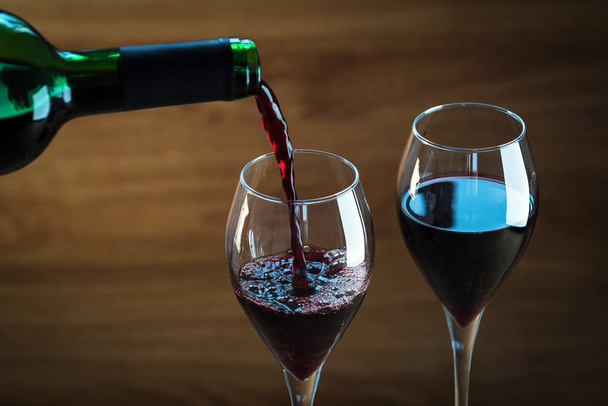 Aromatic wine in glasses on blurred background - Foto, afbeelding