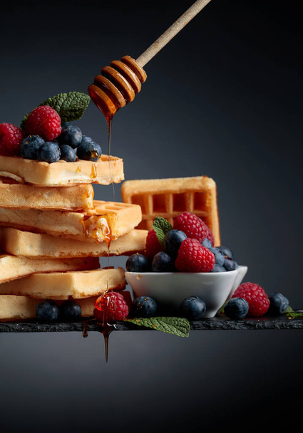 Belgian waffles with  blueberries, raspberries  and fresh mint. - Photo, Image