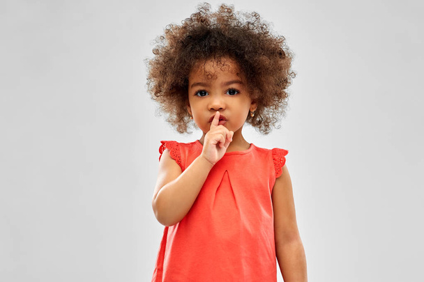 little african american girl making shush gesture - Foto, immagini