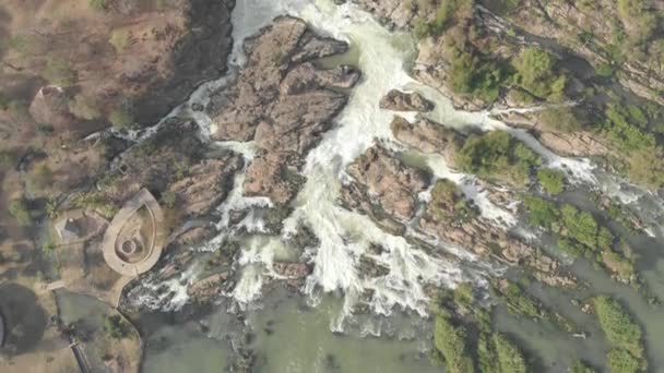 Aerial: flying top down view over Li Phi waterfall, the 3997 islands Mekong River in Laos, famous tourist destination in South East Asia. Native cinelike D-log color profile - Footage, Video