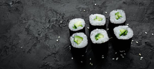Vegetarian sushi roll with cucumber. Japanese cuisine. Top view. - Fotografie, Obrázek