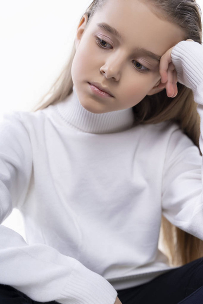 Beautiful cute teen girl wearing a white turtleneck sweater and  - Φωτογραφία, εικόνα