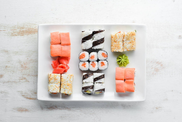 Big Set sushi with soy sauce and wasabi. Free space for your text. Top view. On a stone background. - Fotografie, Obrázek
