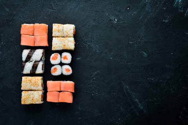 Big Set sushi with soy sauce and wasabi. Free space for your text. Top view. On a stone background. - Foto, immagini