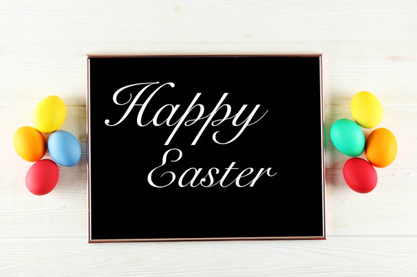 Easter greeting card concept. Festive composition on wooden background. - Fotó, kép