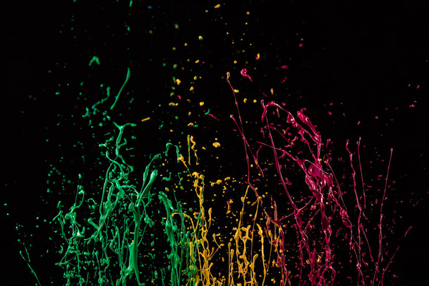 Macro photo of mixed acryl colors on black - Foto, immagini