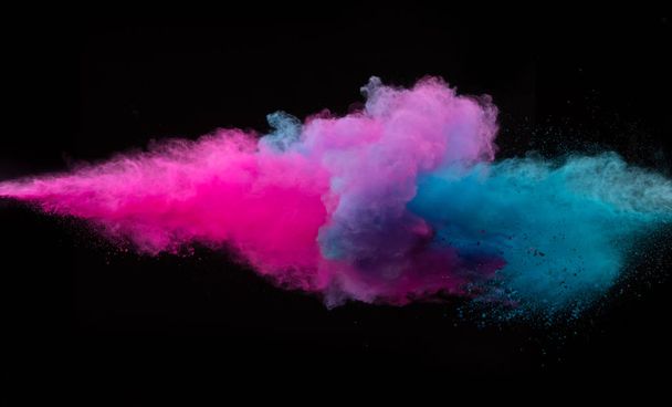 Collision of two colored powders isolated on black - Foto, afbeelding