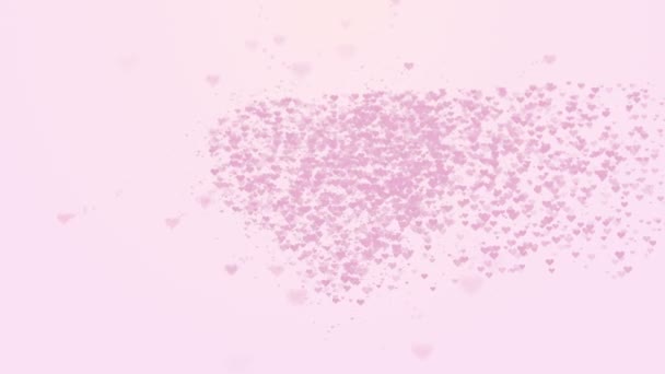 Blurred pink heart is isolated on light pink background. Accumulation of little hearts creates one large heart. Little hearts appearing from right side. Close up. Copy space. - Footage, Video