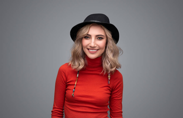 Cheerful woman in black hat - Photo, Image