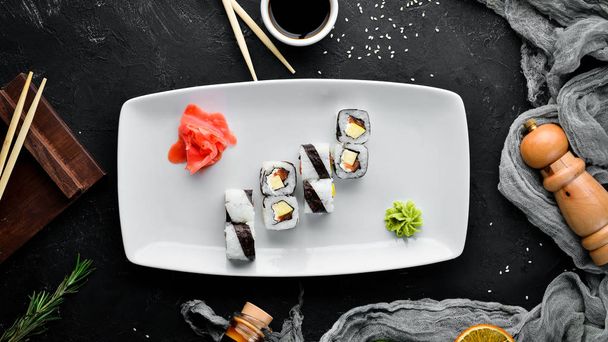 Sushi roll with fish. free space for your text. Top view. On a stone background. - Foto, immagini