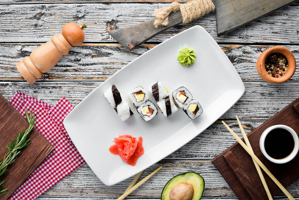 Sushi roll with fish. free space for your text. Top view. On a stone background. - Φωτογραφία, εικόνα