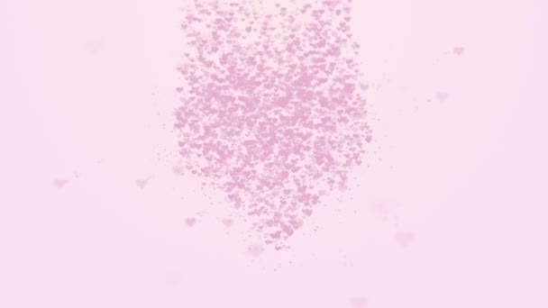 Blurred pink heart is isolated on light pink background. Accumulation of little hearts creates one large heart. Little hearts appear from the top. Close up. Copy space. - Footage, Video