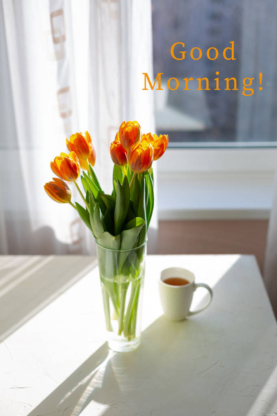 Spring orange tulips in a vase  near the window - Zdjęcie, obraz