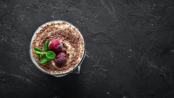 Dessert Tiramisu with cherries. Top view. Free space for your text. - Photo, image