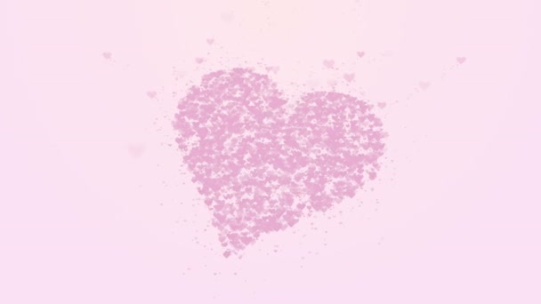 Blurred pink heart is isolated on light pink background. Accumulation of little hearts creates one large heart. Close up. Copy space. - Footage, Video