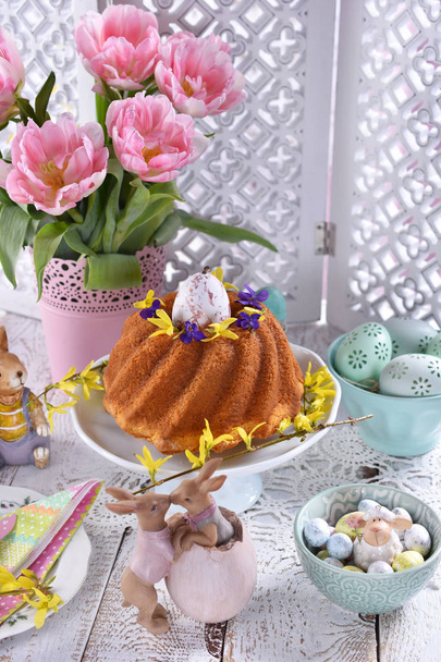 easter festive table with traditional ring cake and tulips - Photo, image
