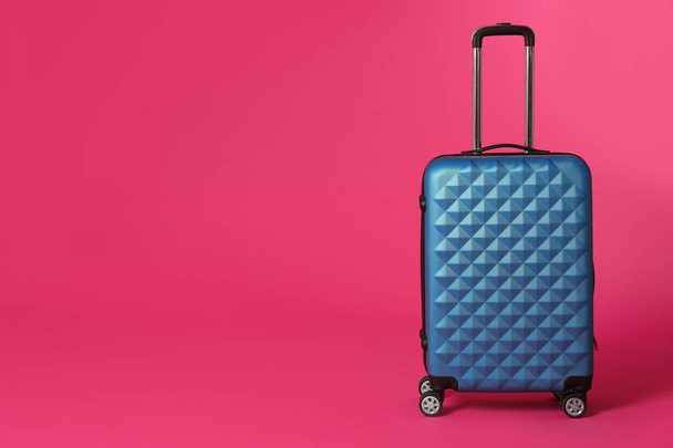 Stylish suitcase on color background. Space for text - Фото, зображення