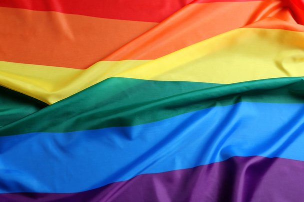 Bright rainbow gay flag as background. LGBT community - Фото, изображение