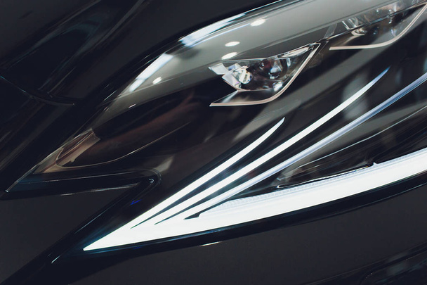 Modern Car Closeup Photo. Headlight and Alloy Wheel Closeup. Modern Transportation. - Foto, Imagem
