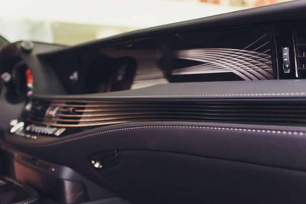 Dark luxury car Interior - steering wheel, shift lever and dashboard. - Fotoğraf, Görsel