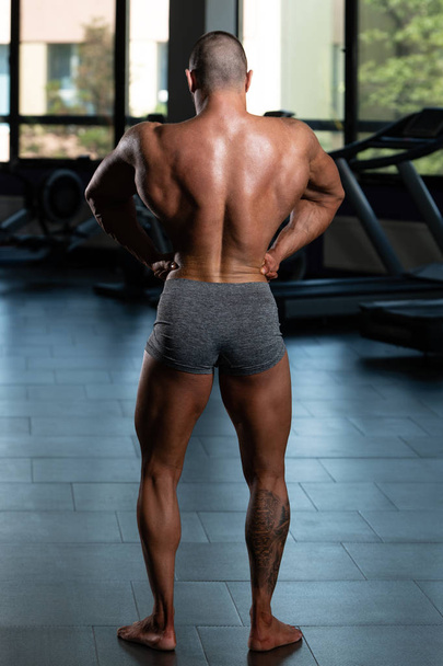 Serious Bodybuilder Standing In The Gym - Fotografie, Obrázek