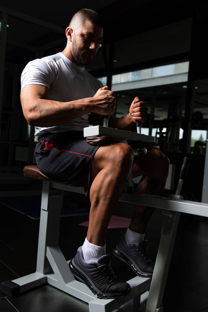 Muscular Man Working Out Calves - 写真・画像