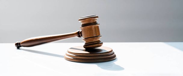 Huge judge's wooden gavel on blurred background - Valokuva, kuva