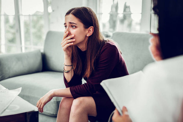 Client of therapist feeling shocked after realizing her problem - Photo, Image