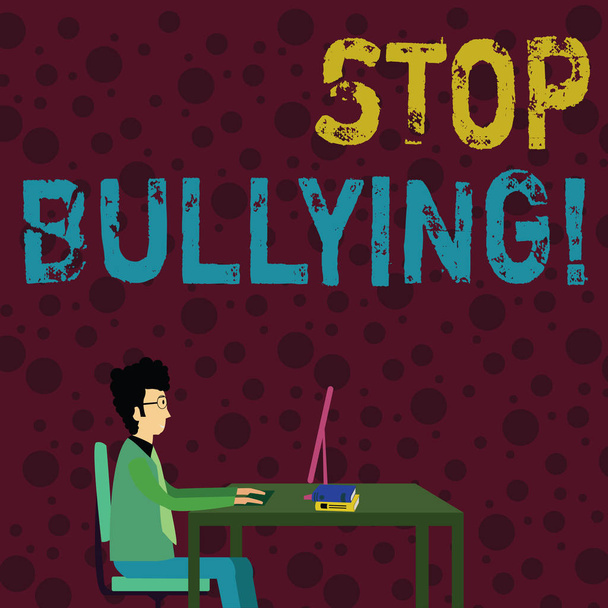 Conceptual hand writing showing Stop Bullying. Business photo text no aggressive behavior among children power imbalance Businessman Sitting on Chair Working on Computer and Books. - Photo, Image