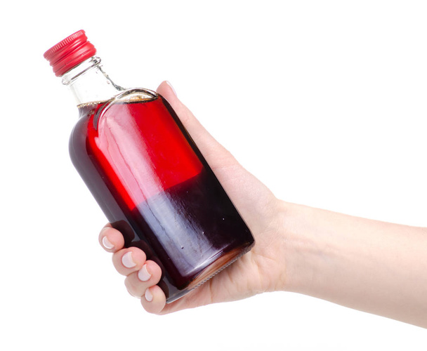 Bottle rosehip syrup in hand - Zdjęcie, obraz