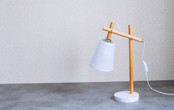 Retro desk lamp on concrete table - Fotoğraf, Görsel
