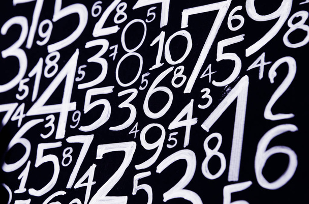 Background of numbers. from zero to nine. Numbers texture. Currency symbols. Numerology. Mathematical equations and formulas - 写真・画像