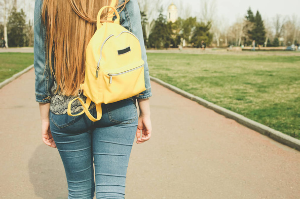 Girl with fashionable bright yellow backpack - Фото, зображення