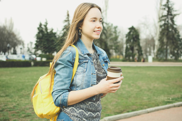  girl with  bright stylish yellow backpack  - Photo, image