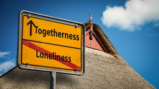 Straatnaambord saamhorigheid versus eenzaamheid - Foto, afbeelding